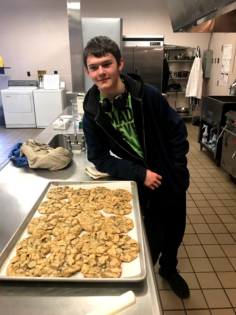Student poses with fresh baked goods